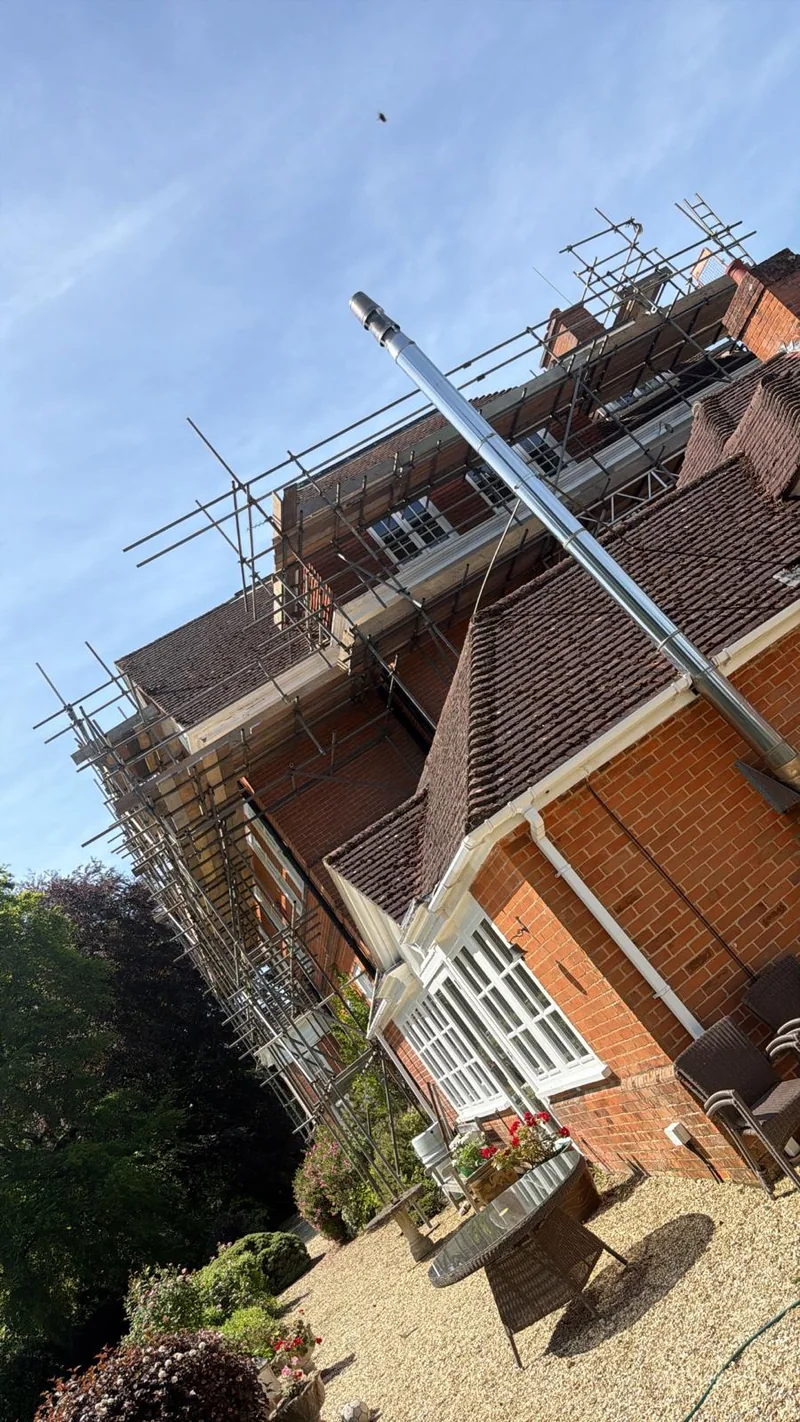 Scaffolding around a large brick property by A&S Scaffolding